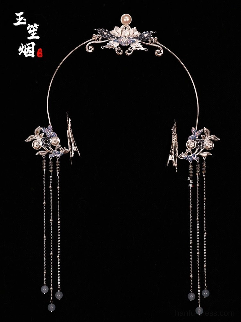 Silver lotus halo Hanfu headpiece with faux pearl blue crystal tassels and matching side hairpins on a black background