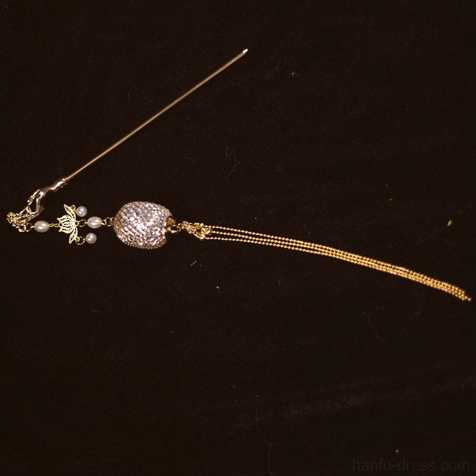 Silver toned Chinese lantern tassel hair pin with stone embellished lantern pendant pearl floral charms and a long chain tassel on black background