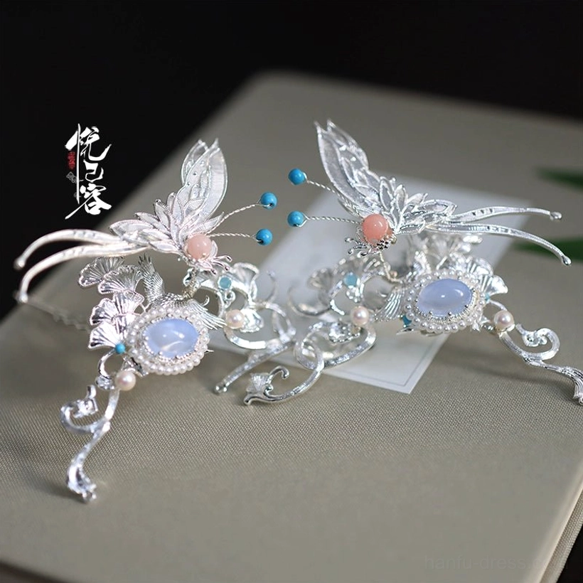 Silver crescent butterfly Chinese hair pin with filigree-style wings, blue agate, pink beads, and pearl ornament details