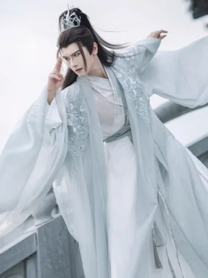 Silver Scale Wei Jin Dynasty hanfu set for men with pale cyan wide sleeve outer robe and flowing white layered robe on a stone bridge