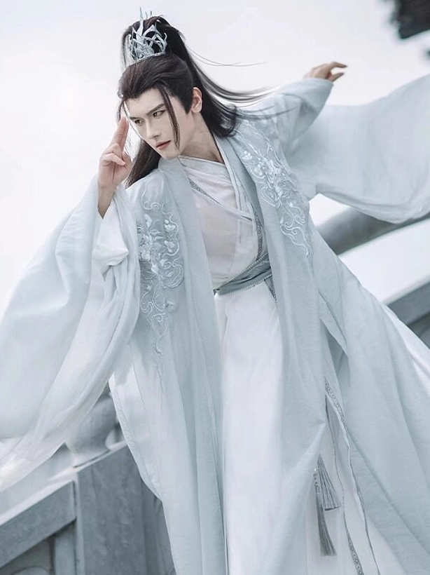 Silver Scale Wei Jin Dynasty hanfu set for men with pale cyan wide sleeve outer robe and flowing white layered robe on a stone bridge