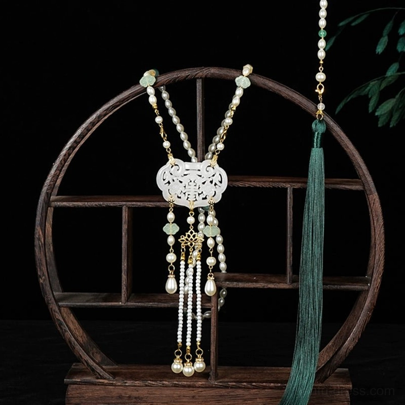 Simplified Chinese style long life lock tassel necklace with hollow white pendant, pearl-like chains, decorative tassel pendants, and dark green side tassel