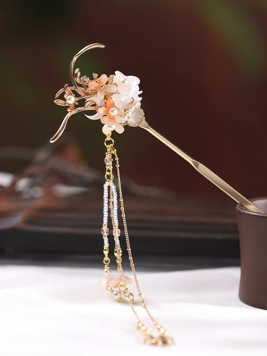 Single traditional Chinese hair stick with gold floral ornament, pink and white flower clusters, pearl accents, and long layered tassels with flower pendants