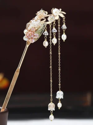 Single champagne gold Hanfu hair stick with glazed leaf, pink enamel flowers, pearl accents, crystal pendants, and delicate hanging tassels