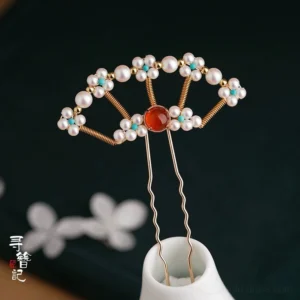 Single Chinese fan-inspired Hanfu hair fork decorated with white pearls, turquoise flowers, gold-tone wire, and round red agate stone