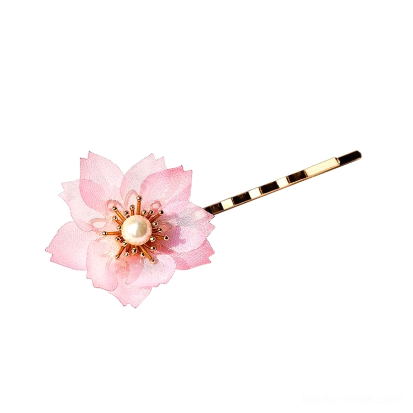 Single pink chiffon cherry blossom hair pin with pearl style center and striped gold tone metal shaft on white background