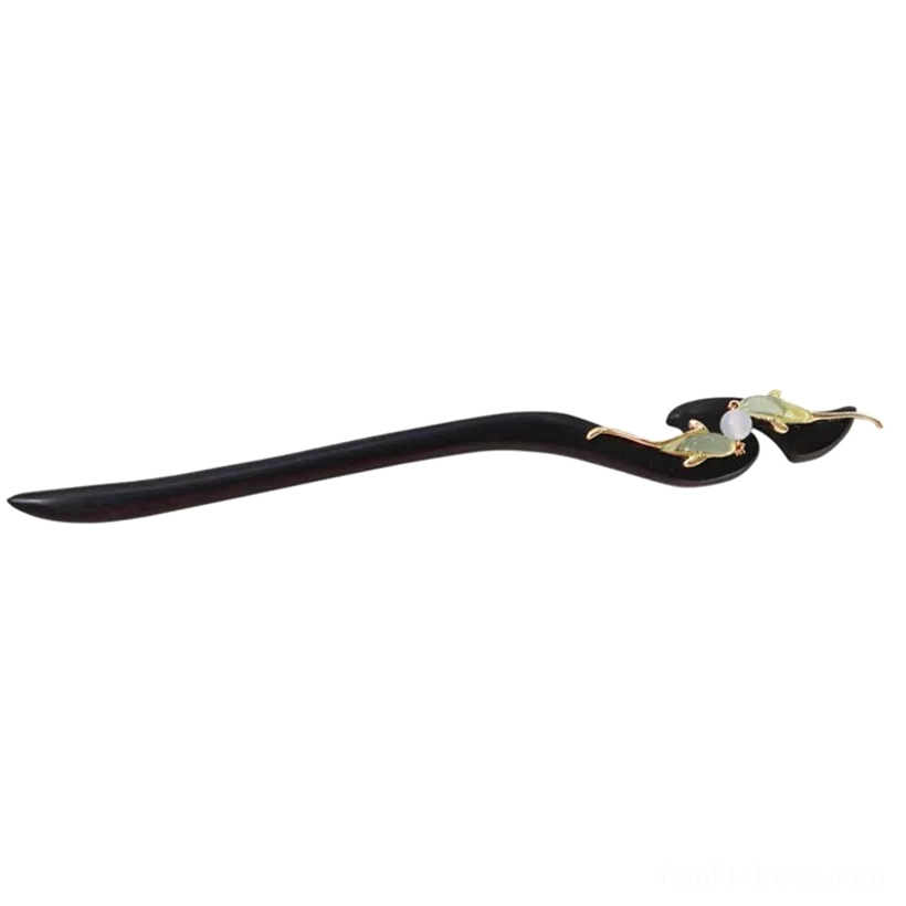 Single traditional Chinese fish hair stick shown from the side with a sleek curved black wooden shaft, gold fish decoration, green accents, and white bead