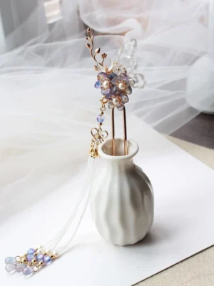 Single vintage-inspired purple flower Chinese hair stick with translucent butterfly ornament, gold branch details, and flowing beaded tassel
