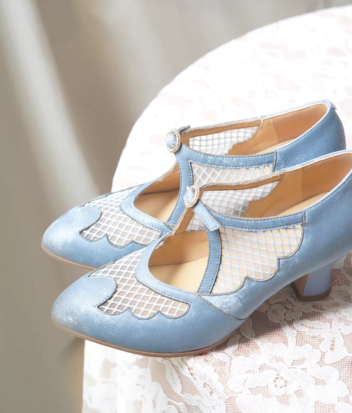 Pair of sky blue vintage Cheongsam Mary Jane heels with low block heels scalloped fishnet mesh and decorative T-straps