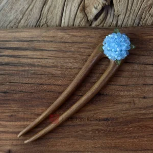 Handmade sky blue hydrangea-inspired Chinese hair stick with opalescent floral beads and green metal accents for Hanfu, qipao, cheongsam, and traditional Chinese hairstyles