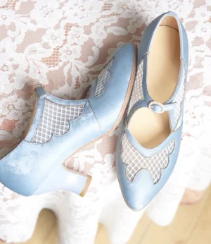 Top view of sky blue Chinese qipao Mary Jane heels showing pointed toes scalloped mesh cutout panels and leather insoles