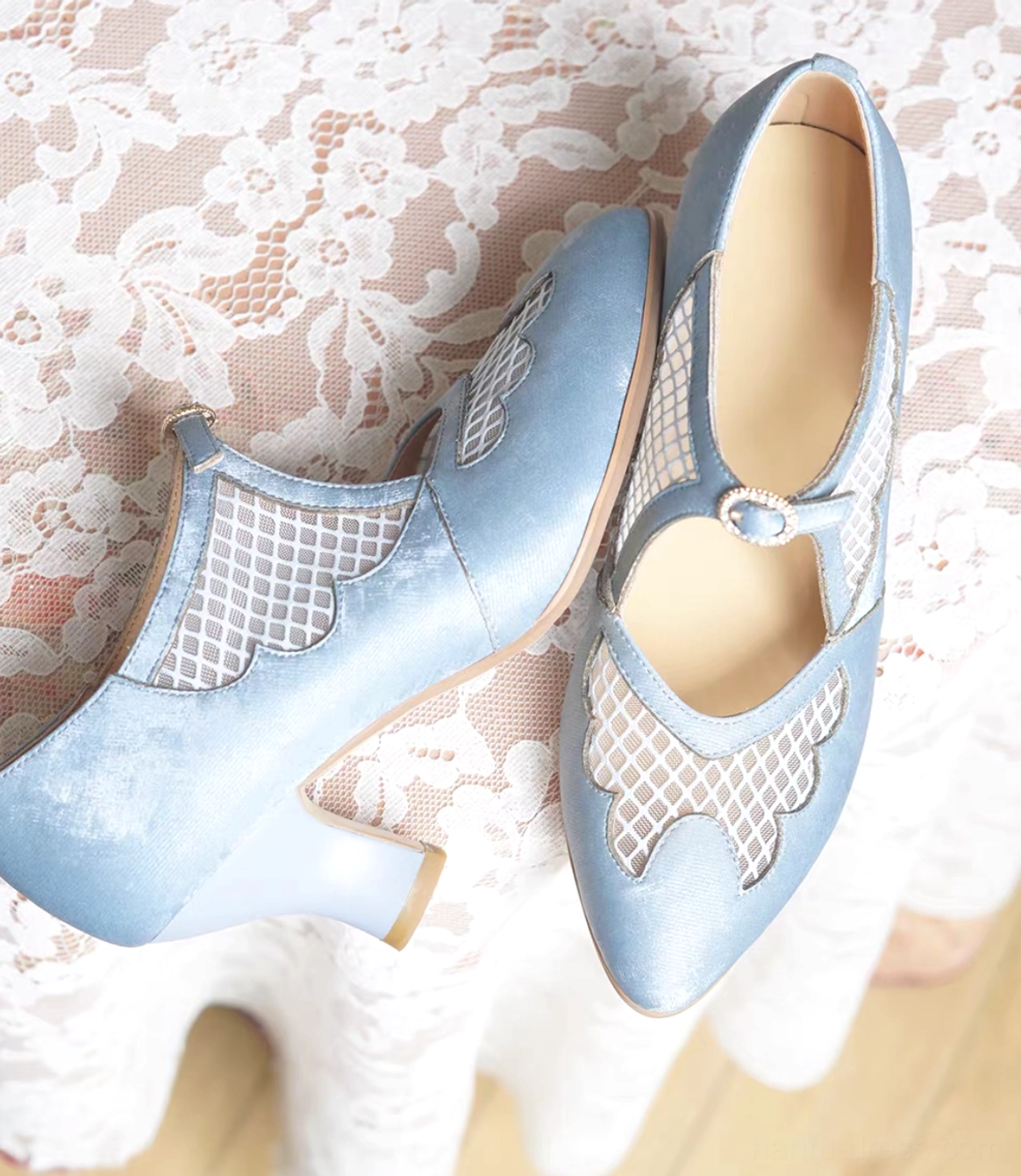 Top view of sky blue Chinese qipao Mary Jane heels showing pointed toes scalloped mesh cutout panels and leather insoles