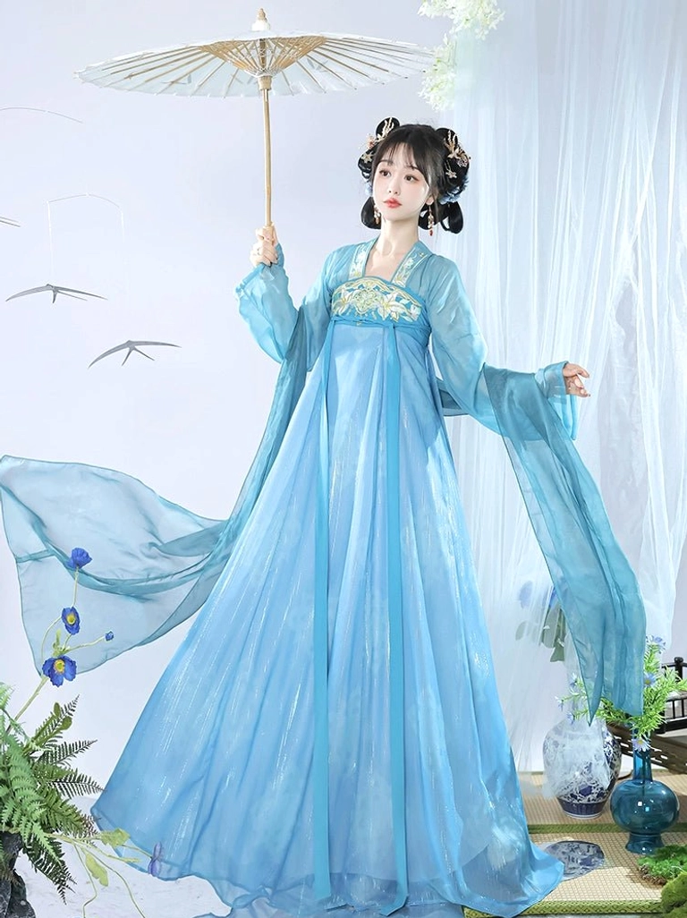 Sky blue Qixiong Ruqun Tang Dynasty Hanfu model holding a traditional bamboo oil-paper umbrella with flowing chiffon skirt and decorative silk sashes