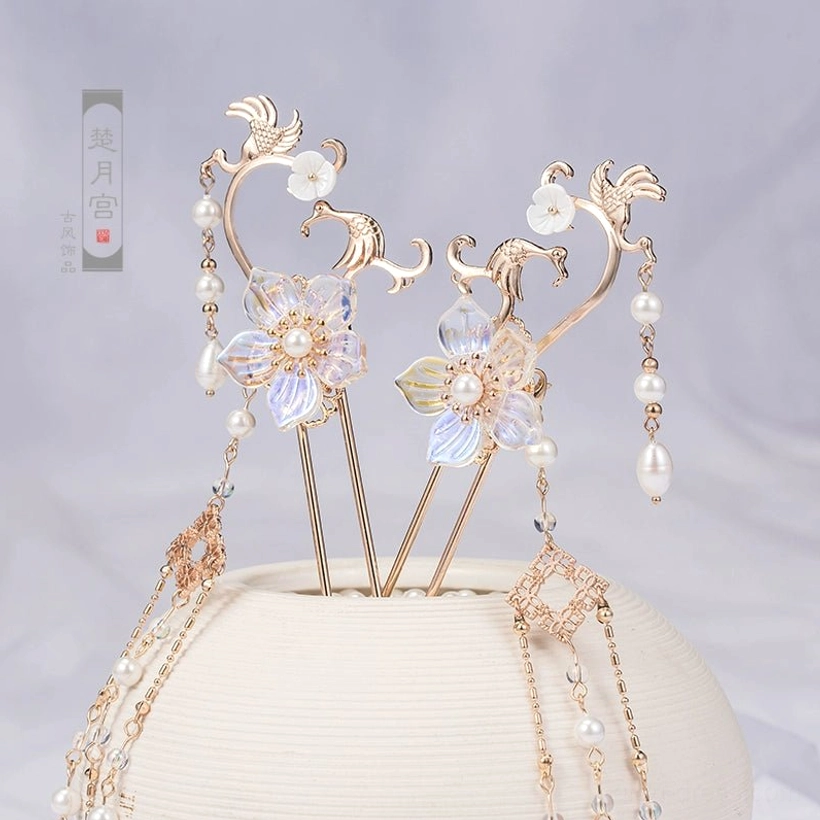 Pair of Sky Phoenix hanfu hairpins with gold toned decorative frames, iridescent glass flowers, pearl accents, and long dangling tassels
