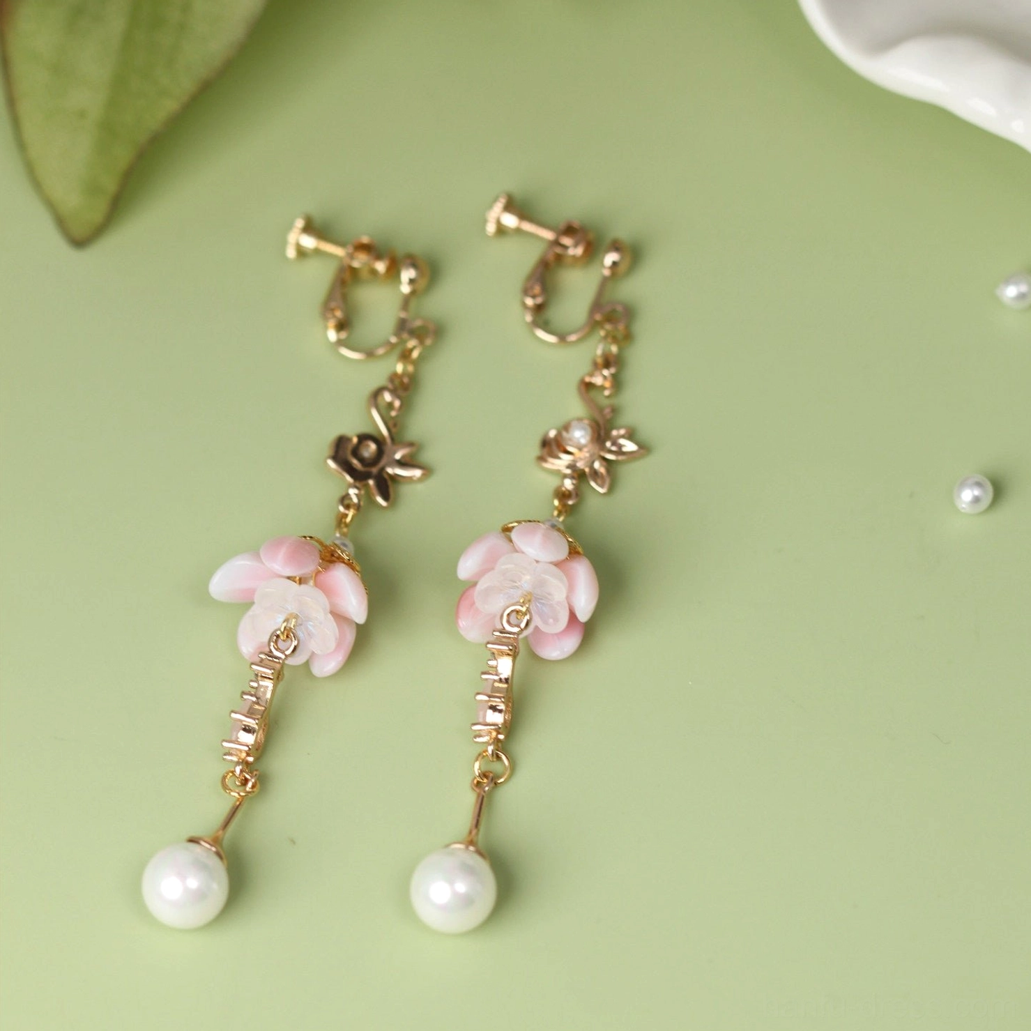Comfort clip-on Chinese flower earrings for non-pierced ears with pink blossom pendants, gold filigree details and pearl drops