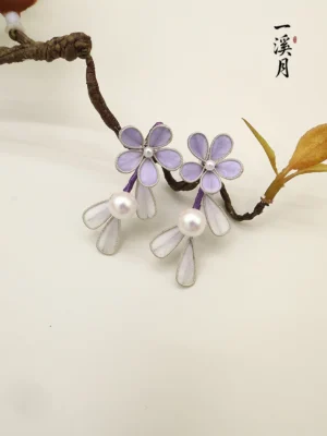 Smoke purple flower pearl drop Hanfu earrings displayed on a natural twig, featuring five petal floral details, silver edging, translucent white petal charms, and elegant Chinese jewelry styling