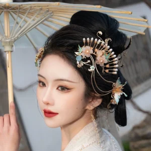 Side view of Smoke and Rain Hanfu hair accessories with pink flowers blue butterflies pearl tassels and traditional hairstyle