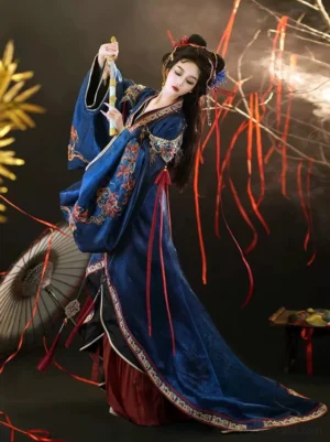 Three-quarter view of a Warring States and Han Dynasty inspired Hanfu robe showing embroidered shoulders, flowing red sashes, wide sleeves, and a floor-length trailing silhouette