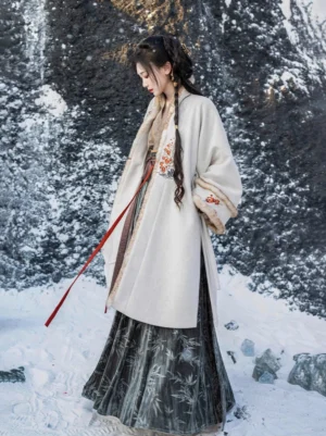 Apricot Song Dynasty inspired hanfu velvet jacket with beige faux fur trim and grey bamboo wrap skirt back view