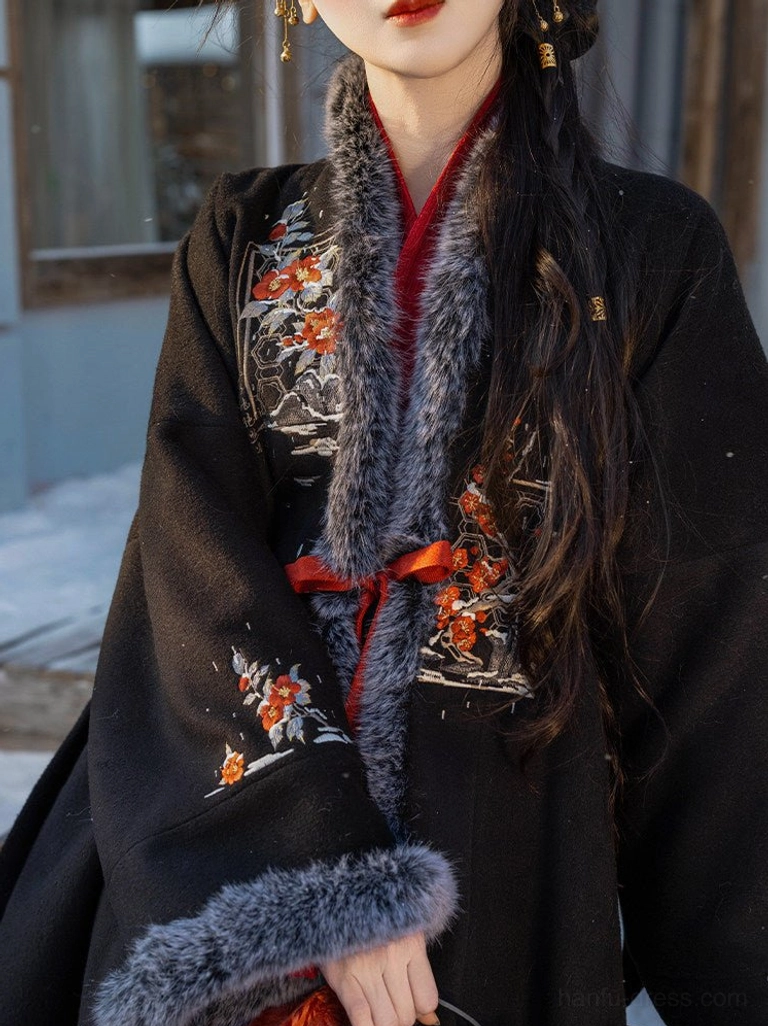 Close up of black Song Dynasty hanfu velvet jacket with grey faux fur collar floral embroidery and red waist tie