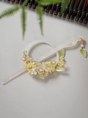 Snow lotus Chinese hair pin and round back clasp flat lay with translucent imitation jade finish yellow floral beads green leaf ornaments