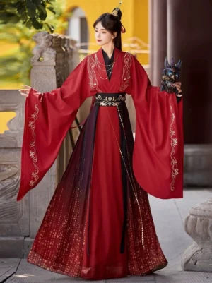 Solid red Wei Jin Dynasty Qiyao Ruqun Hanfu three quarter view with gold embroidered wide sleeves, sparkling gradient skirt, black waist belt, and elegant traditional Chinese costume styling