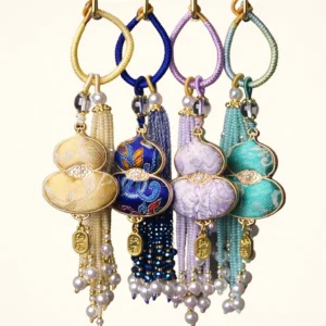Four color variants of Song brocade gourd Chinese keychain bag charms in beige navy lilac and turquoise with braided wrist straps and bead tassels