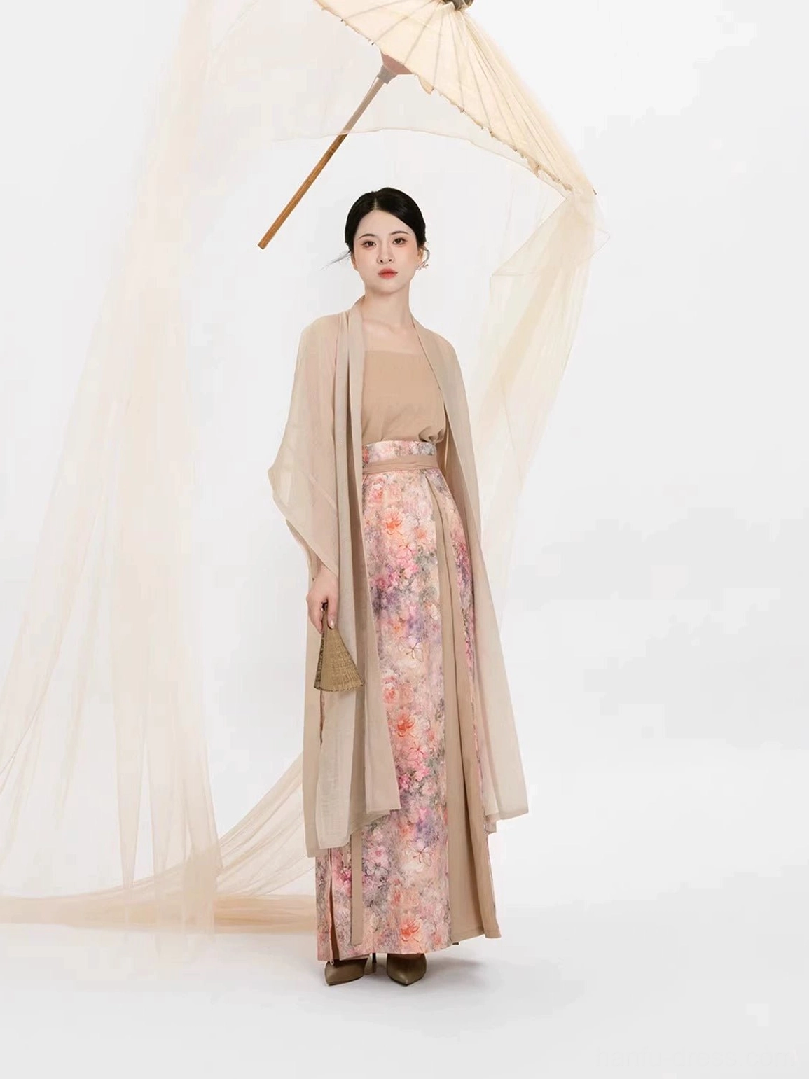 Song Dynasty Hanfu outfit with flowing beige beizi jacket and pastel floral pleated skirt shown in side front view