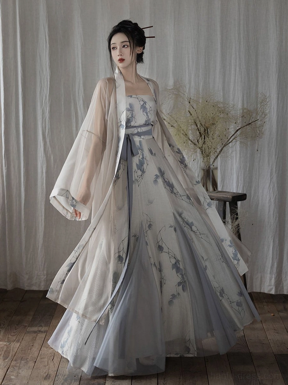 Full Song Dynasty Hanfu set in ivory and dusty blue with floral camisole, flowing long jacket, and pleated wrap skirt front view