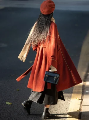 Back view of brick red modern Song Dynasty Hanfu winter jacket with contrast lining and long layered silhouette
