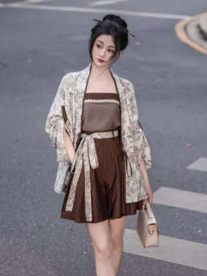 Modern Song Dynasty Hanfu camisole cardigan and coffee brown wide-leg shorts outfit worn on an urban crosswalk