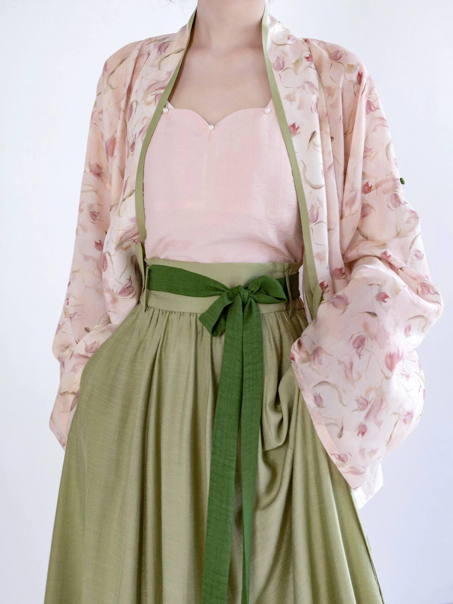 Close-up view of Song Dynasty Hanfu cardigan, sweetheart camisole neckline, green trim, waist sash, and lightweight breathable fabric texture