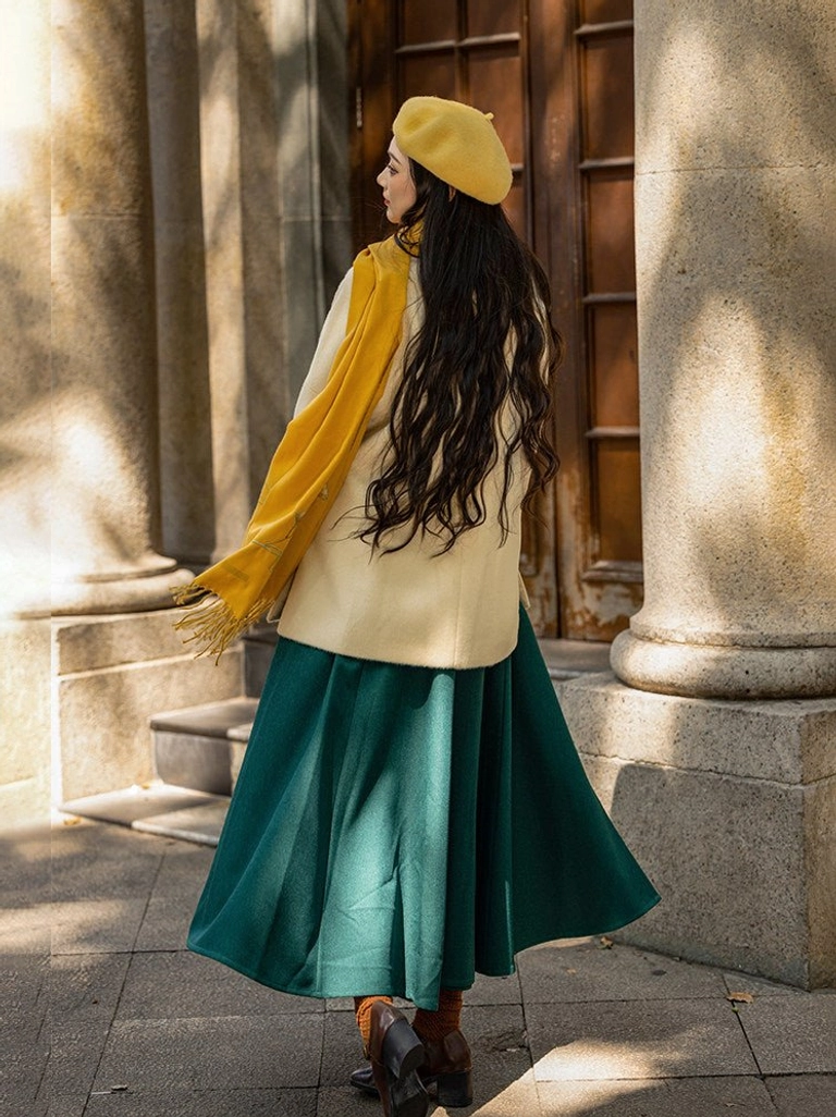Back view of a Song Dynasty inspired Hanfu coat and dark emerald green pleated wrap skirt styled for autumn and winter