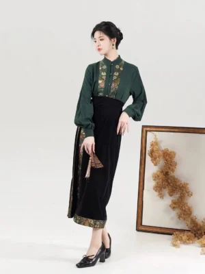 Song Dynasty inspired Hanfu set side view showing gold floral embroidery on green blouse and black velvet skirt tassel detail