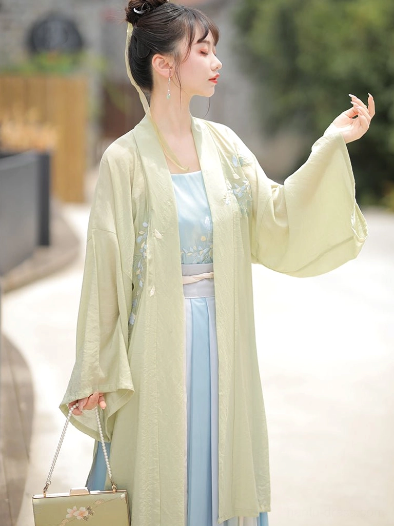 Close side profile of floral embroidered matcha green beizi coat from Song Dynasty style Hanfu outfit
