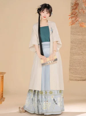 Front view of a Song Dynasty Hanfu set with ivory short-sleeve beizi, teal inner camisole, light blue floral embroidered mamian skirt, and traditional Chinese styling