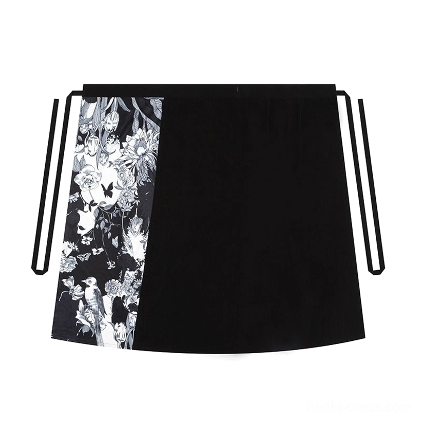 Flat lay view of the long Song Dynasty Hanfu wrap skirt with two-tone black and ink floral panels and long black waist ties