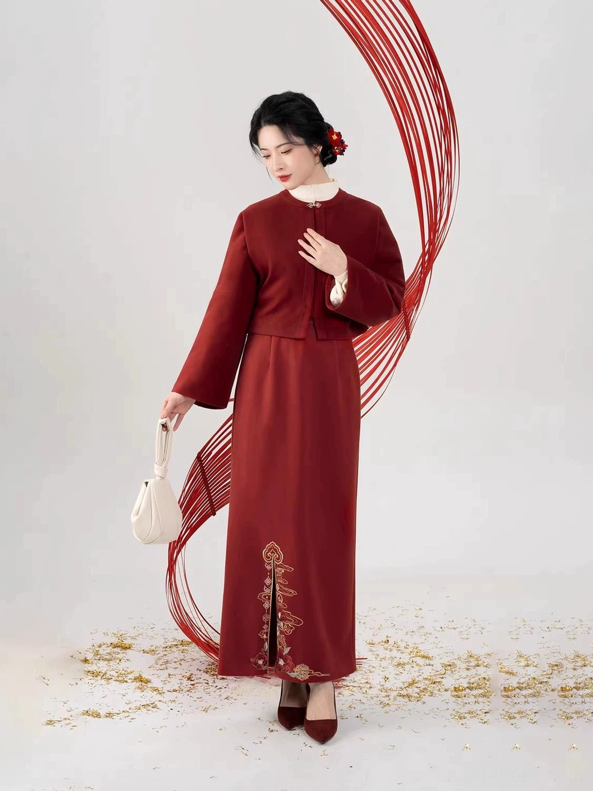Three-quarter view of a Song Dynasty inspired Hanfu jacket and burgundy high-waisted slit skirt with elegant golden floral embroidery