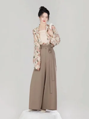 Modern Song Dynasty hanfu three-piece set with floral chiffon wing-sleeve top, beige camisole, and camel brown high-waisted palazzo pants