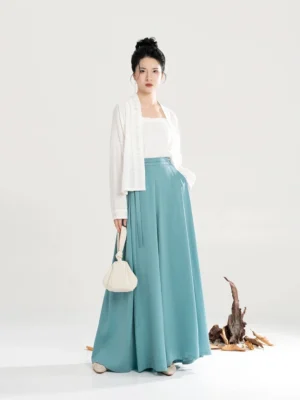 White modern Song Dynasty Hanfu set with short beizi top, square-neck camisole, teal wide-leg pants, and round handbag