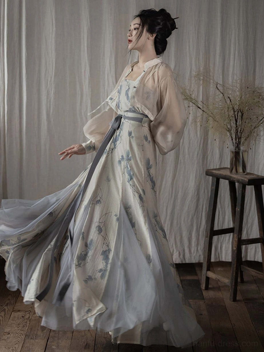Side view of Song Dynasty inspired Hanfu showing high-waisted blue floral pleated wrap skirt and dusty blue gradient hem