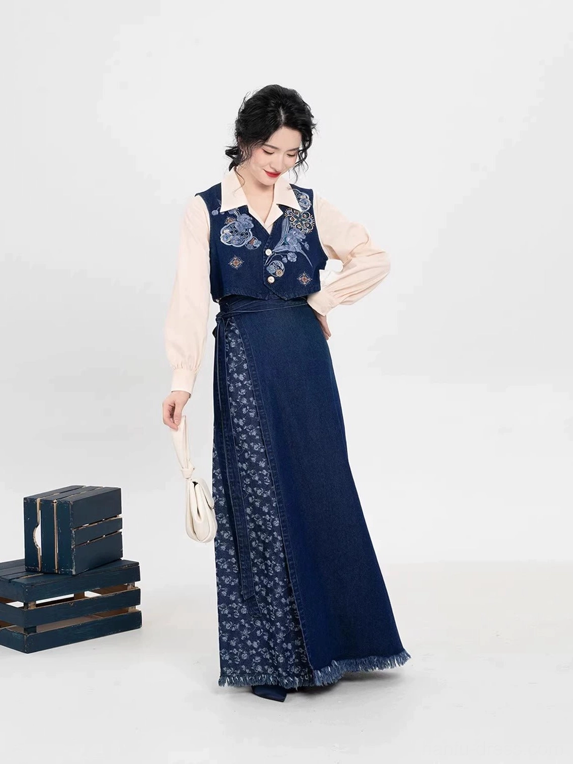 Three-quarter view of Song Dynasty inspired Hanfu set with navy embroidered majia and floral-panel denim-style skirt