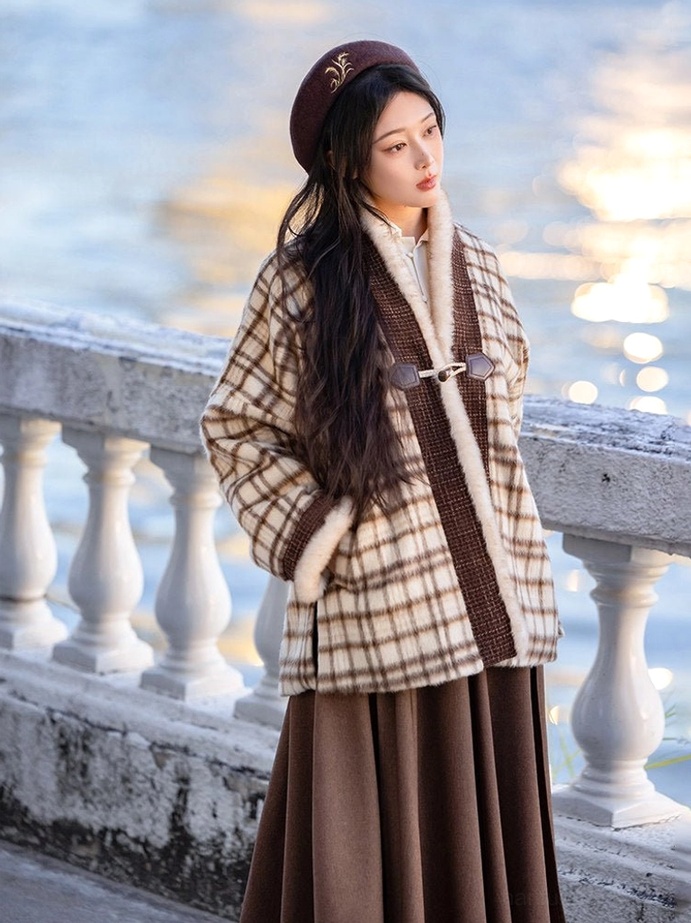 Side profile of a model wearing a Song Dynasty inspired hanfu jacket and pleated wrap skirt outdoors