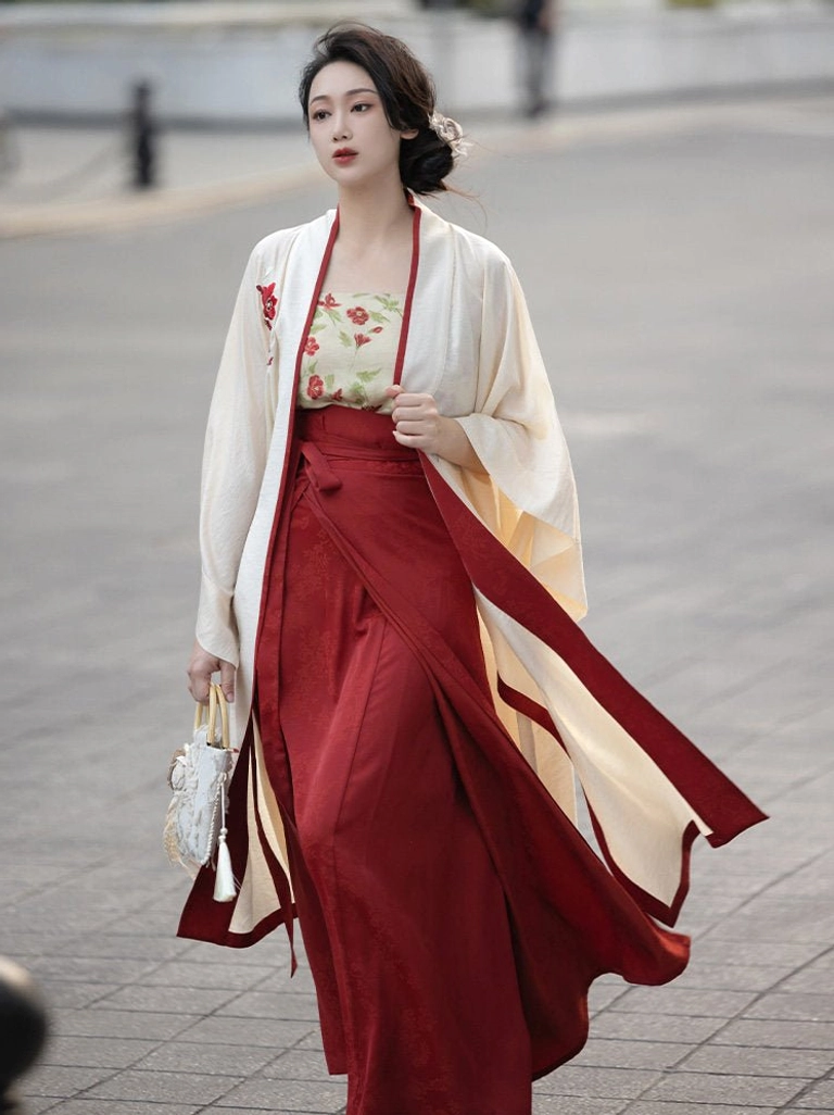 Side view of Song Dynasty inspired Hanfu set showing floral lapel embroidery, flowing skirt ties, elegant silhouette, and traditional Chinese fashion details