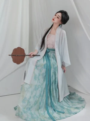 Song Dynasty lotus hanfu full set side view with sheer light blue cardigan pink trim and cyan pleated floral skirt