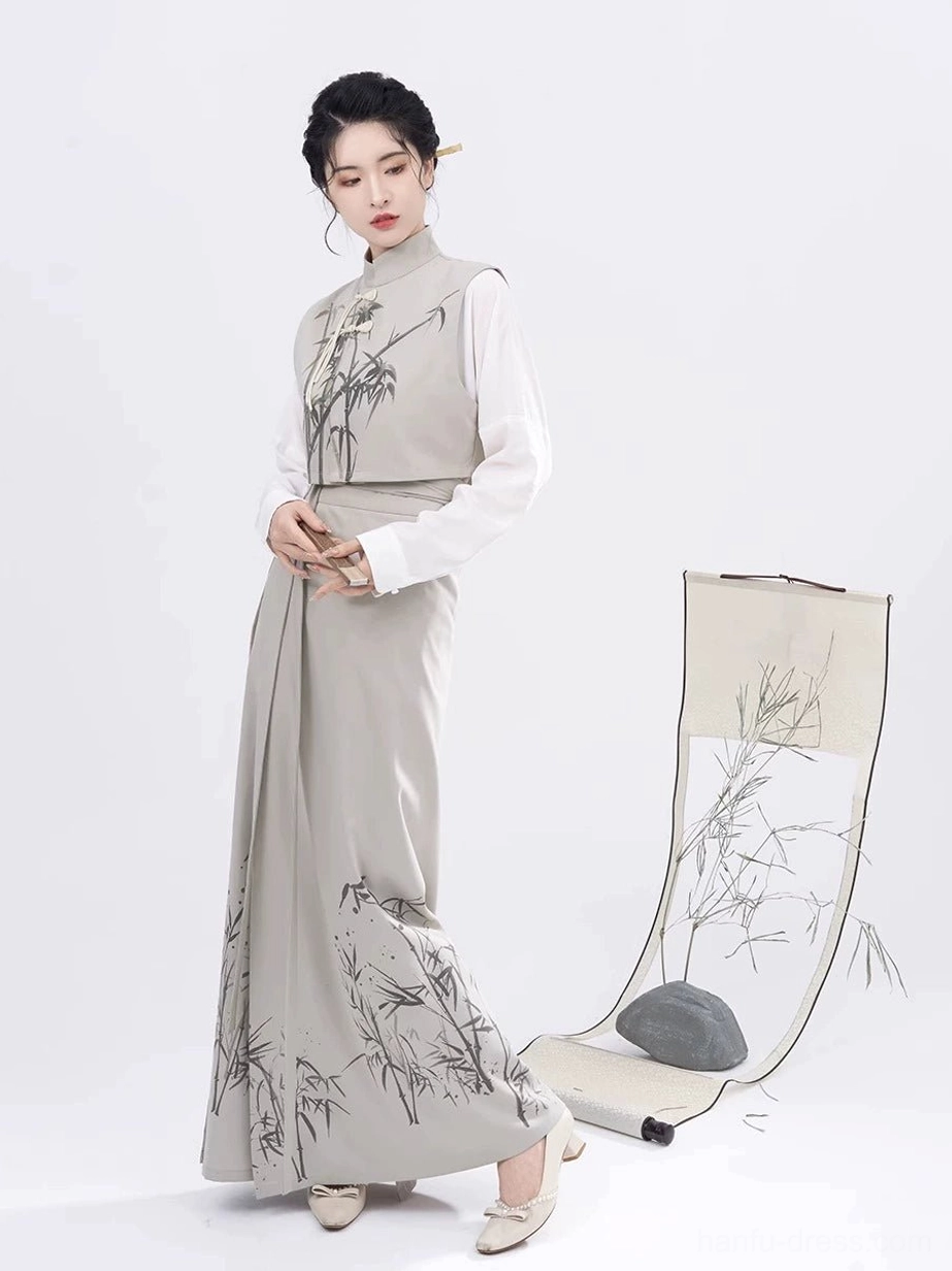 Full-body three-quarter view of a modern Song Dynasty Hanfu three-piece set with off-white top, bamboo print Majia vest, light grey wrap skirt, and elegant oriental styling