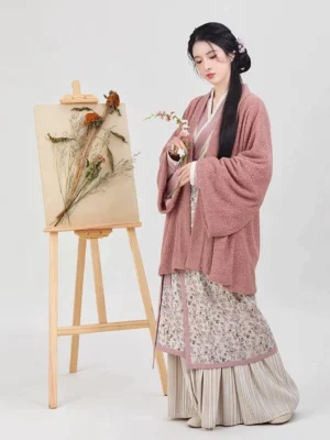 Song Dynasty modern Hanfu set in begonia pink with fuzzy outer jacket, winged sleeve top, floral spiral skirt, and striped pleated hem