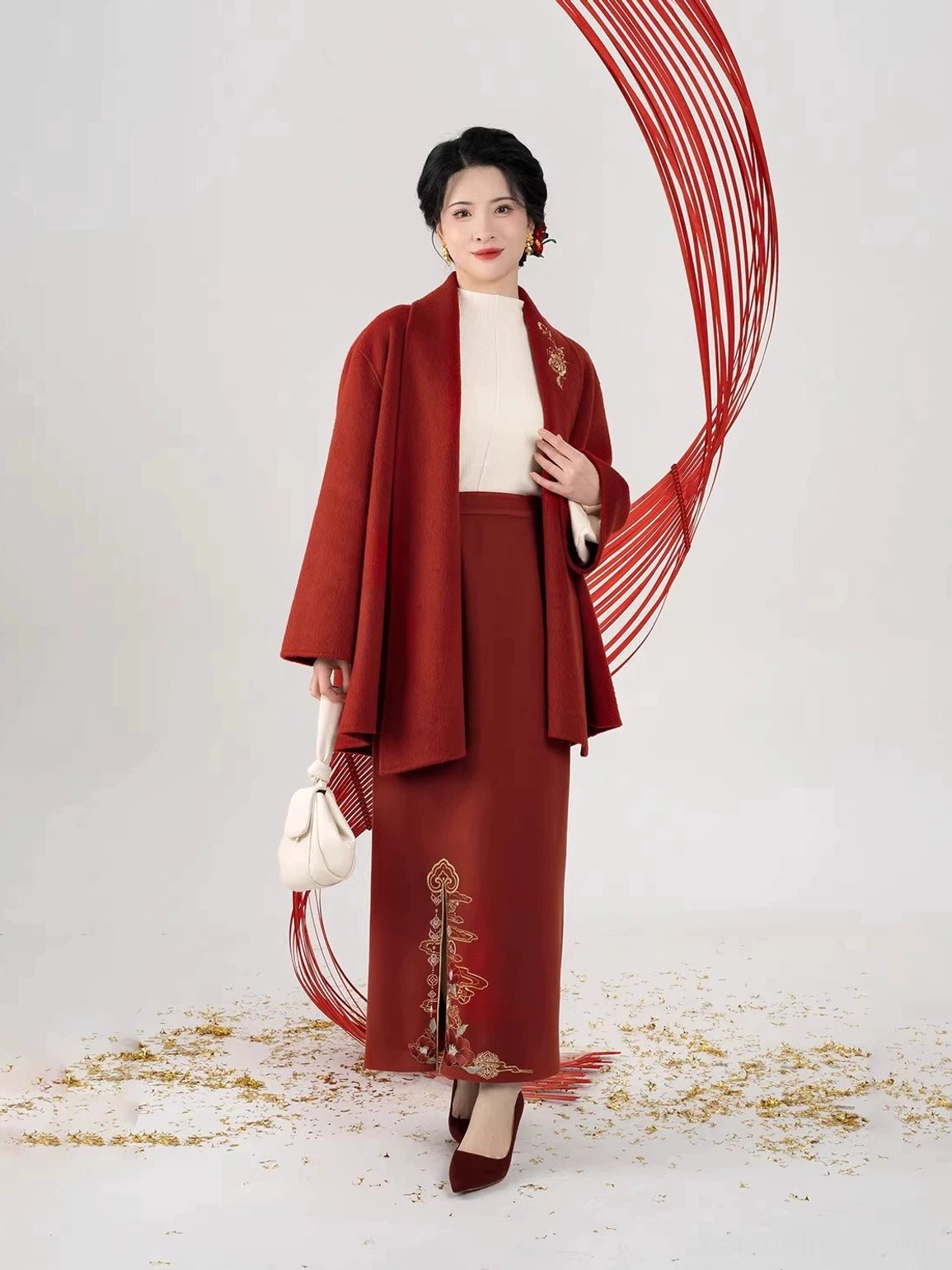 Full body front view of a modern Song Dynasty Hanfu set with burgundy embroidered slit skirt and relaxed jacket styled with handbag and heels
