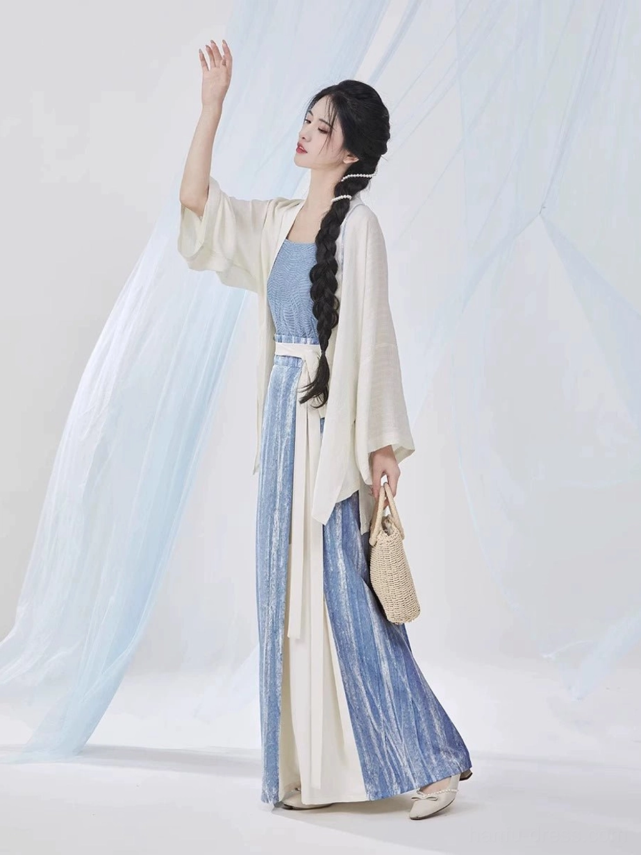 Three-quarter side view of a woman wearing a flowing Song Dynasty modern Hanfu outfit with a long pleated skirt and lightweight ivory outer shirt