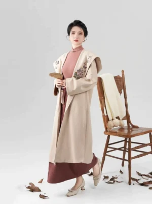 Full body front view of modern Song Dynasty Hanfu set with cream embroidered hooded jacket terracotta stand collar top and long wrap skirt